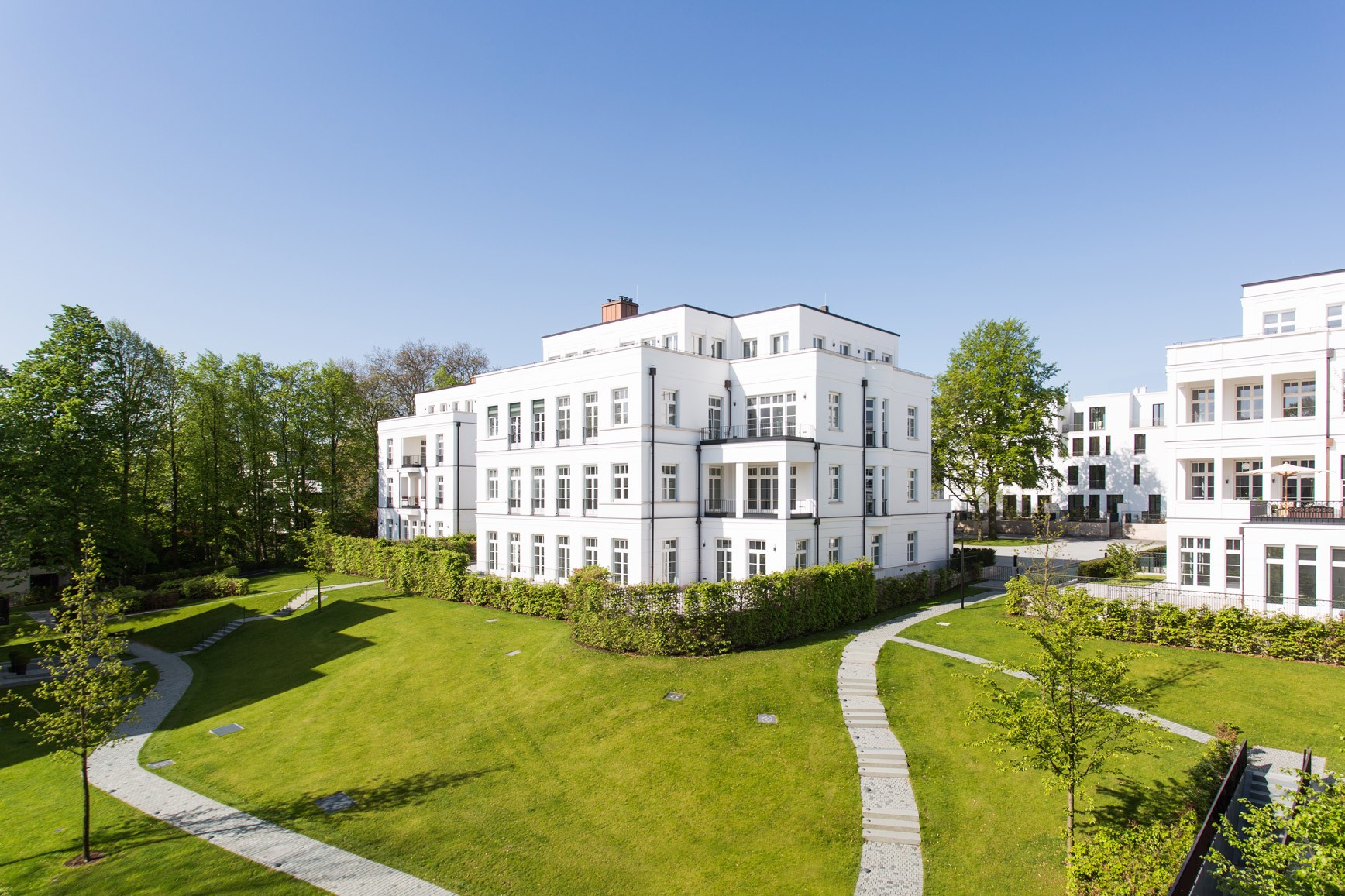 Neoclassical villa in the Sophienterrassen park with curving paths
